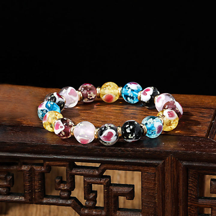 Buddha Stones Gold Schluckendes Biest Familie Rosa Liebesherz Leuchtendes fluoreszierendes Liuli-Glasperlenarmband