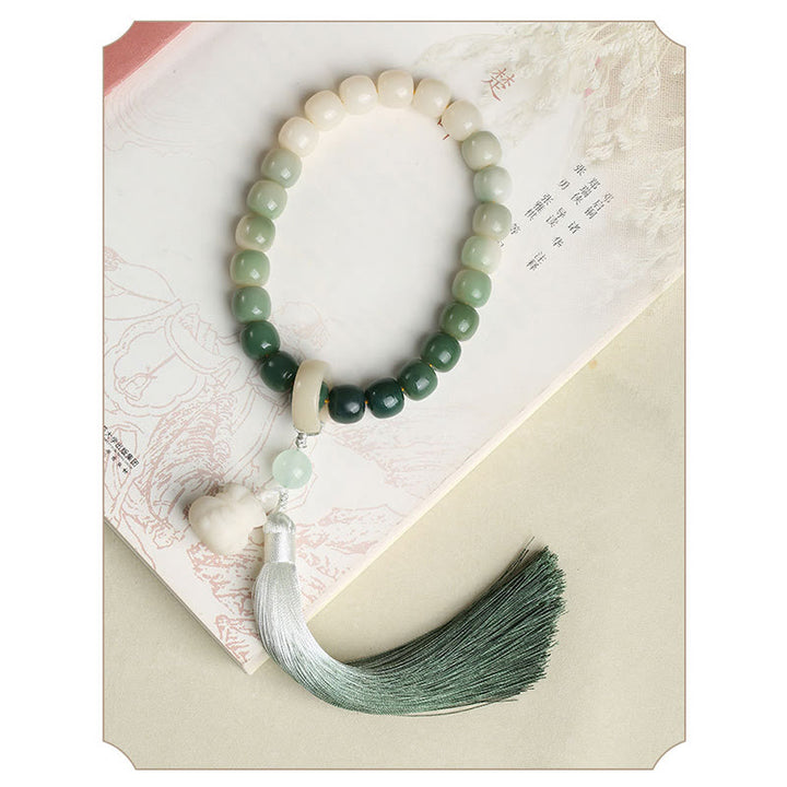 Natürlicher Farbverlauf Bodhi Seed Fortune Geldbeutel Lotus Weisheit Quaste Handgelenk Mala