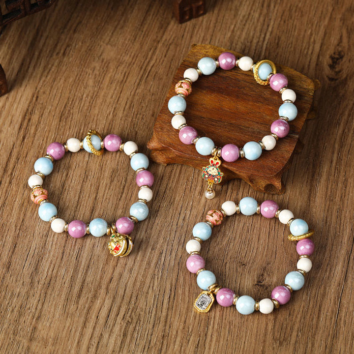 Buddha Stones, tibetische Zakiram-Göttin des Reichtums, Kaninchen-Löwenkopf-Charm, Liuli-Glas, Weihrauch, Esche, Porzellanperlen, Schutzarmband