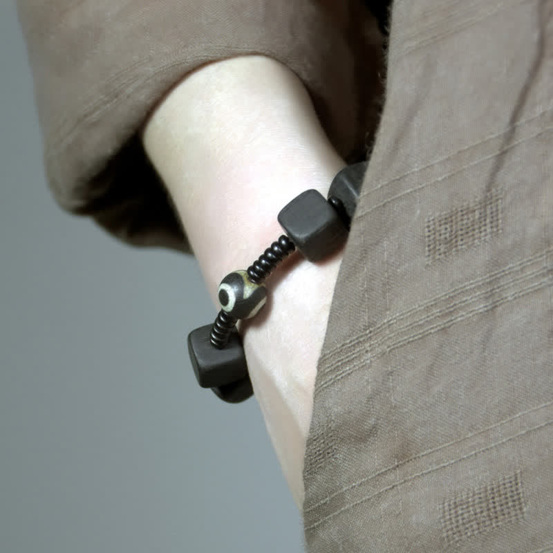 Buddha Stones tibetisches Ebenholz-Dzi-Perlen-Stärke-Armband