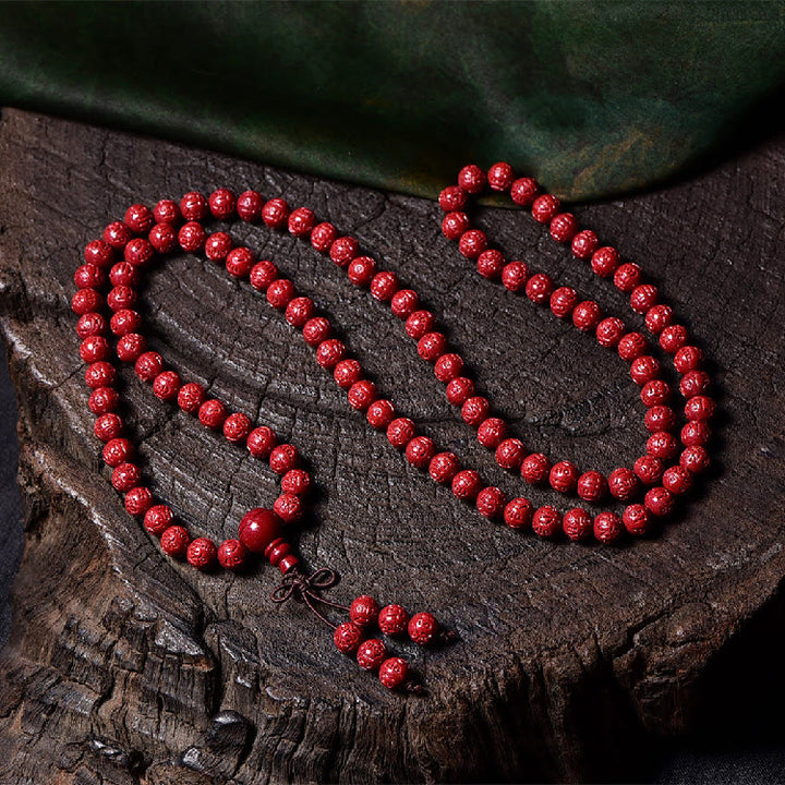 Buddha Stones 108 Mala Perlen Zinnober Om Mani Padme Hum Muster graviertes Segensarmband