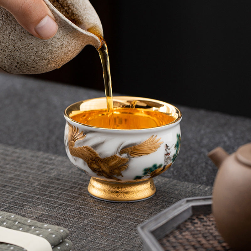 Buddha Stones, goldener Adler, verheißungsvoller Drache, Sonne, Ozean, Wellen, vergoldete Keramik-Teetasse, Kung-Fu-Teetasse
