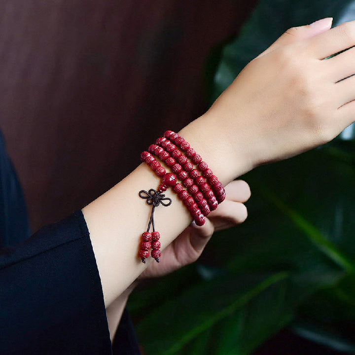 Buddha Stones 108 Mala Perlen Zinnober Om Mani Padme Hum Muster graviertes Segensarmband