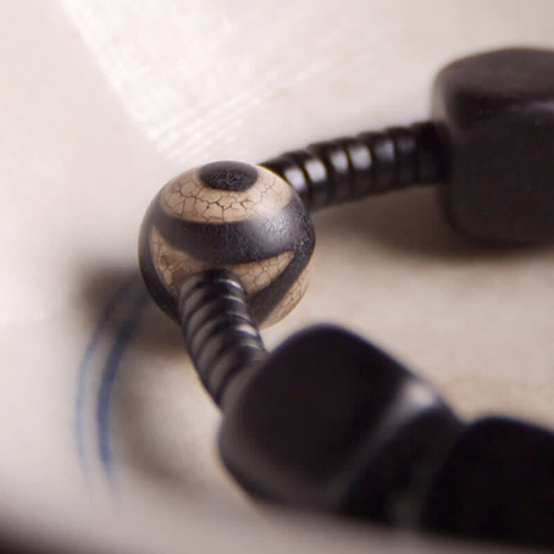 Buddha Stones tibetisches Ebenholz-Dzi-Perlen-Stärke-Armband