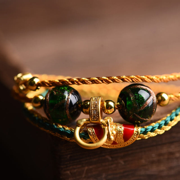 Buddha Stones Tibetisches handgemachtes Seil Liuli Glasperlen geflochtenes mehrschichtiges Heilarmband