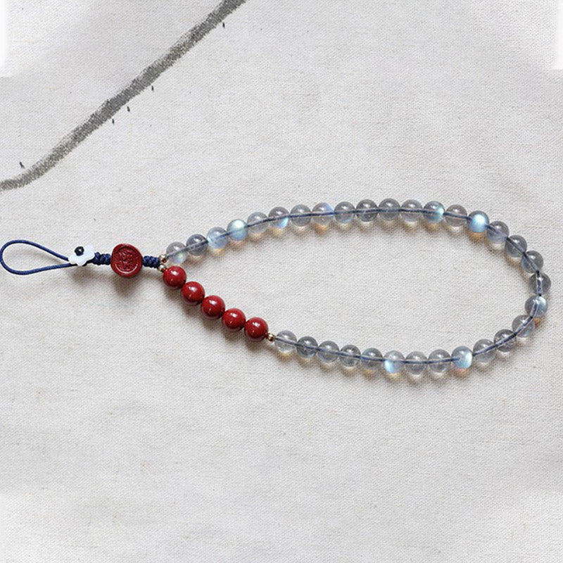 Natürlicher Mondstein, Zinnober, ruhige, positive Telefondekoration