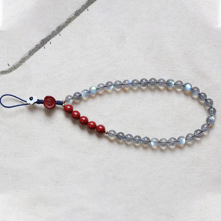 Natürlicher Mondstein, Zinnober, ruhige, positive Telefondekoration