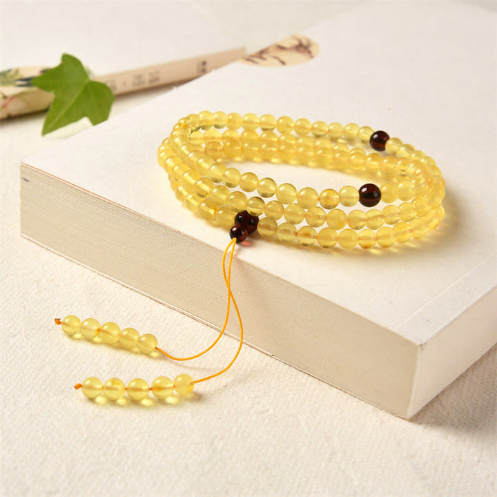Buddha Stones 108 Mala-Perlen, natürlicher Bernstein, klares Angstarmband