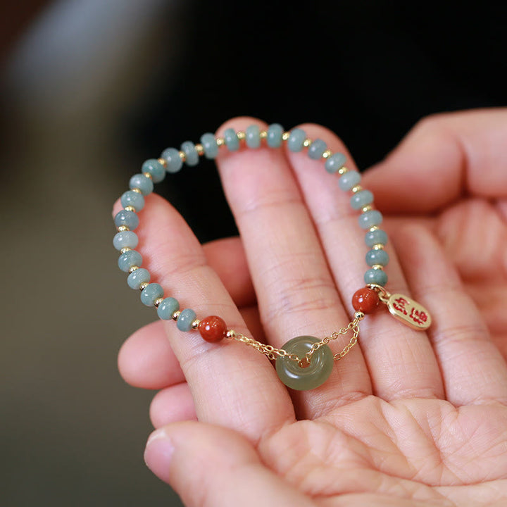 Buddha Stones Natürliches Hetian-Jade-Armband mit rotem Achat, Friedensschnalle, Glücksbringer