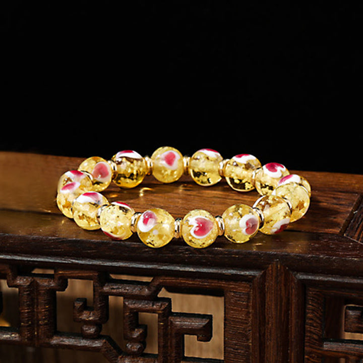 Buddha Stones Gold Schluckendes Biest Familie Rosa Liebesherz Leuchtendes fluoreszierendes Liuli-Glasperlenarmband