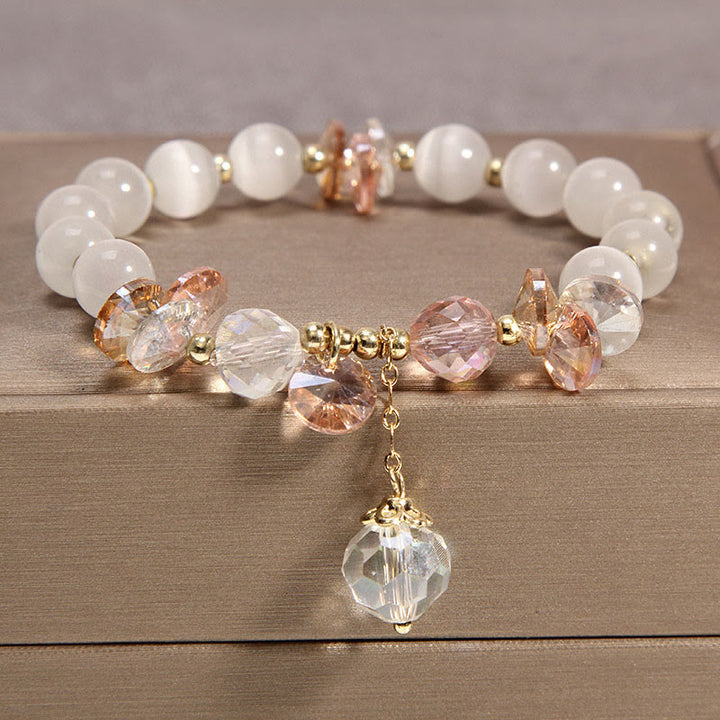 Buddha Stones Katzenauge rosa Kristall-Friedens-Charm-Armband