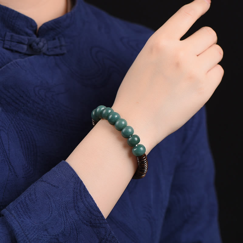 Tibetisches Cyan Bodhi Seed Dzi Perlen-Kokosnussschalen-Armband, das böse Geister fernhält