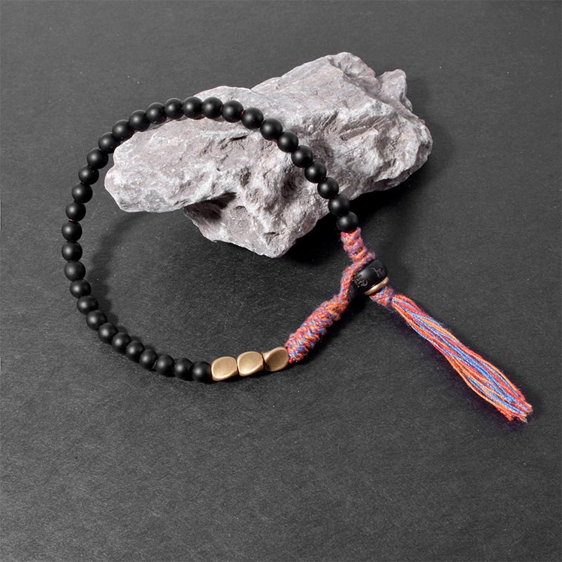 Buddha Stones Handgefertigtes tibetisches schwarzes Onyx-Quastenarmband