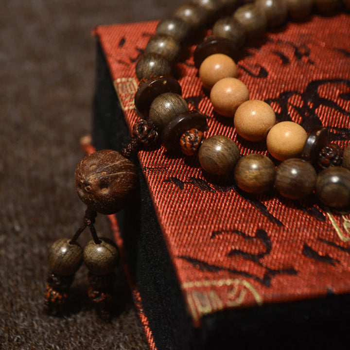 Buddha Stones Mala-Armband aus tibetischem Sandelholz mit Schutzamulett - image 11