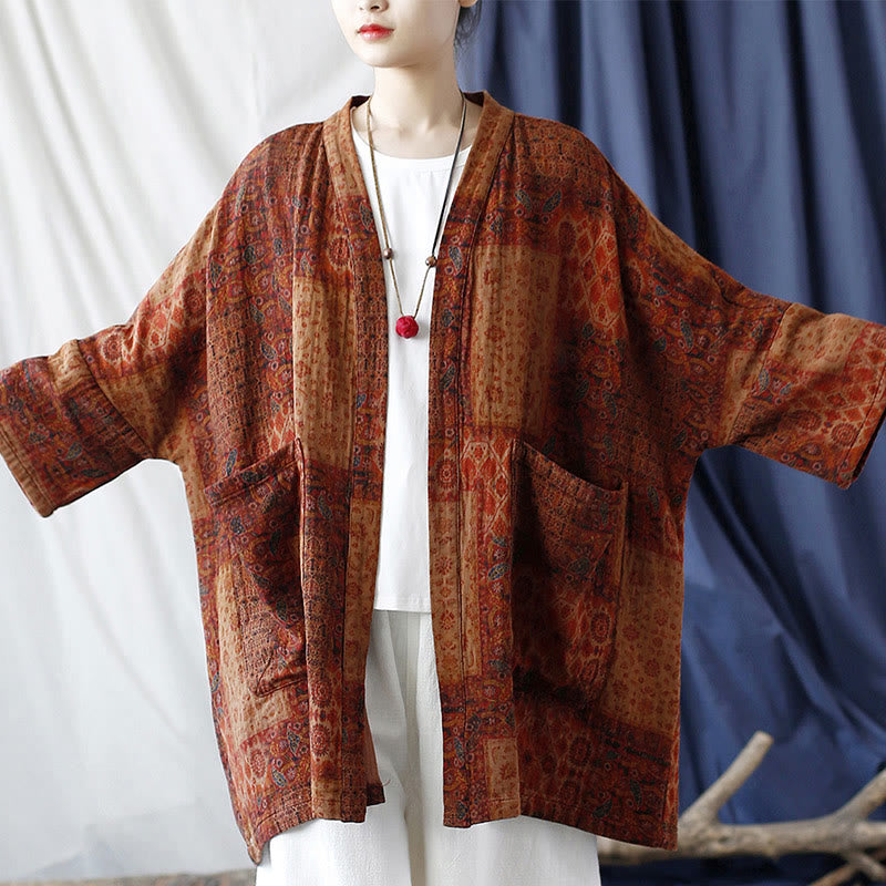 Buddha Stones – Orangefarbene Baumwolljacke mit geometrischem Blumenmuster und offener Vorderseite und Taschen