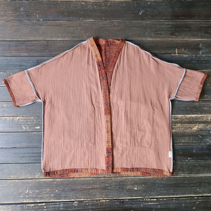 Buddha Stones – Orangefarbene Baumwolljacke mit geometrischem Blumenmuster und offener Vorderseite und Taschen