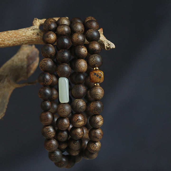 Buddha Stones 108 Mala-Perlen Brunei Adlerholz Hetian Jade Yakknochen Stärke Balance Armband