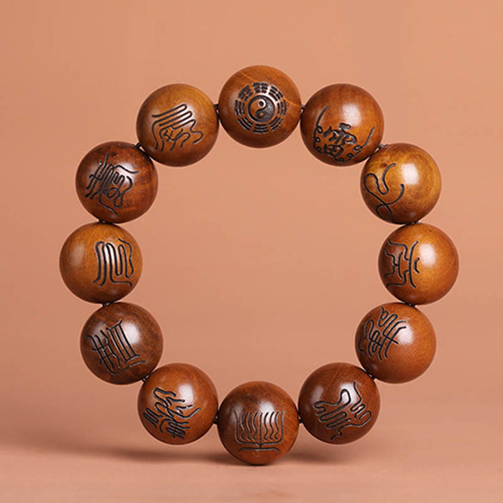 Armband mit eingraviertem Glückssymbol und Buddha-Steinen aus Jujube-Holz mit Yin-Yang-Baguas und taoistischem Tabu-Symbol