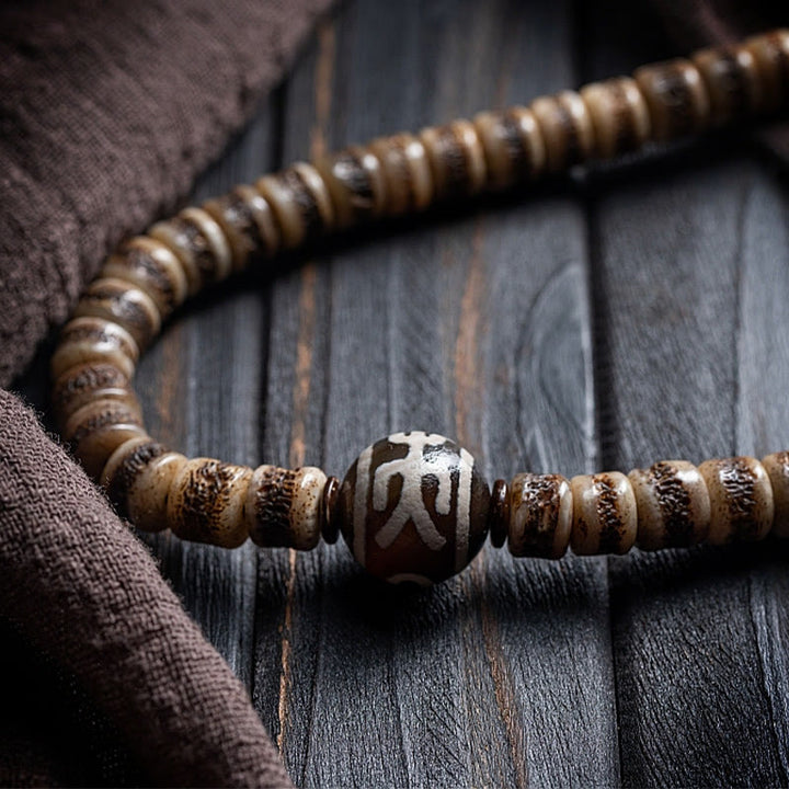 Buddha Stones Tibetische 108 Mala-Perlen aus Yak-Knochen, Dzi-Perle „Der Herr des Leichenwaldes“, Stärke-Armband