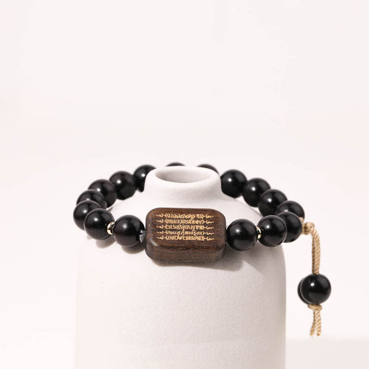 Buddha Stones Ebenholzschnitzerei mit Friedensgebet-Armband