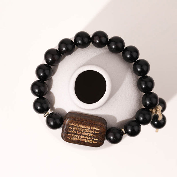 Buddha Stones Ebenholzschnitzerei mit Friedensgebet-Armband