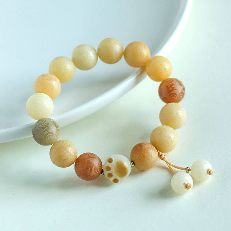 Buddha Stones Bodhisamen Om Mani Padme Hum geschnitztes Harmonie-Armband