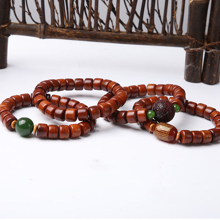 Buddha Stones Tibetische Knochenperlen Dreiäugige Dzi-Perle Schafshorn Roter Achat Stärkearmband