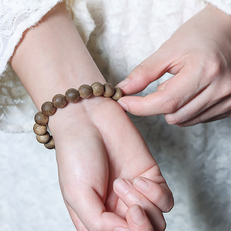 Buddha Stones Natürliches Armband aus Adlerholz mit Brunei-Textur