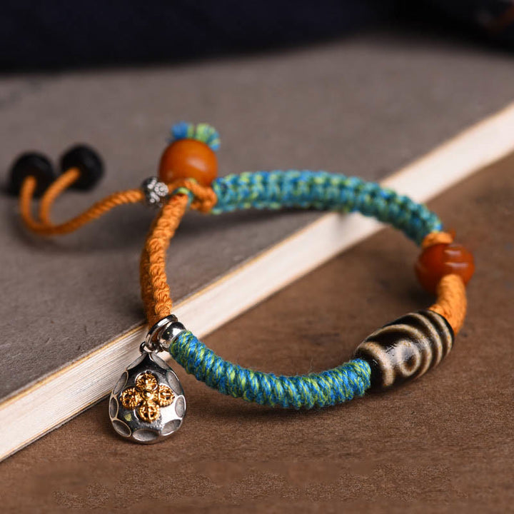 Handgemachtes geflochtenes Armband aus tibetischen Dzi-Perlen mit Buddha Stones