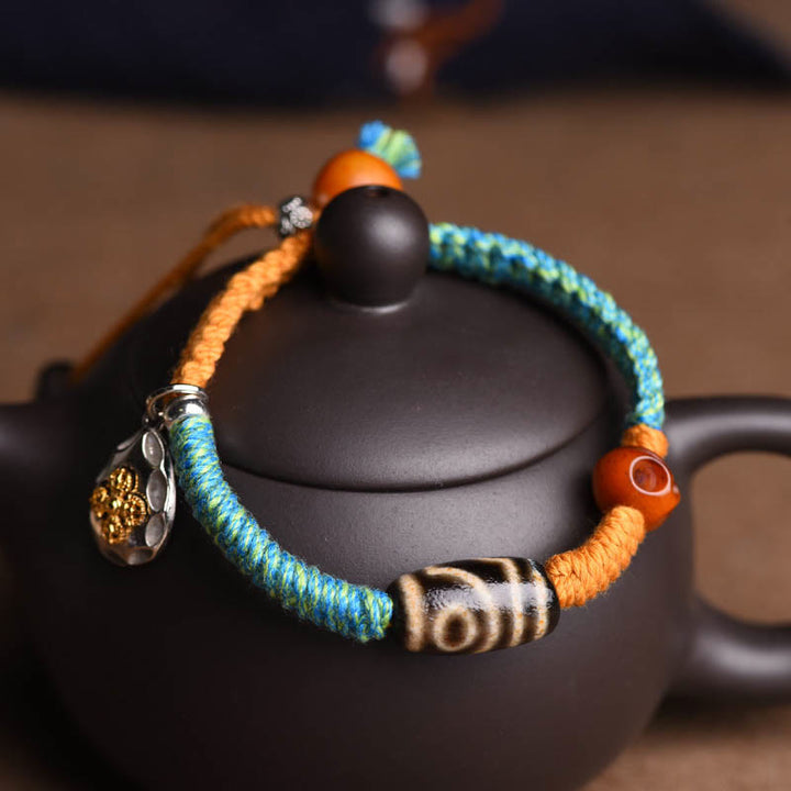 Handgemachtes geflochtenes Armband aus tibetischen Dzi-Perlen mit Buddha Stones