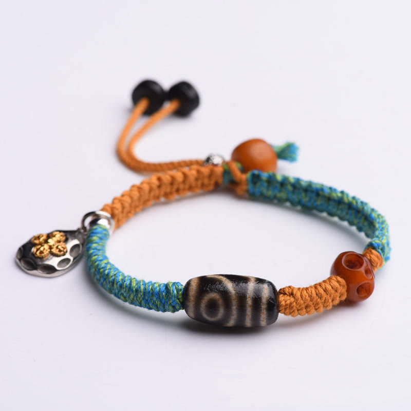 Handgemachtes geflochtenes Armband aus tibetischen Dzi-Perlen mit Buddha Stones