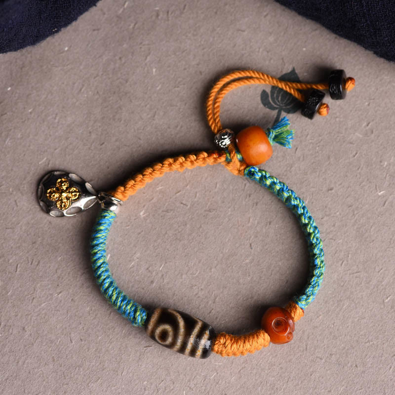 Handgemachtes geflochtenes Armband aus tibetischen Dzi-Perlen mit Buddha Stones