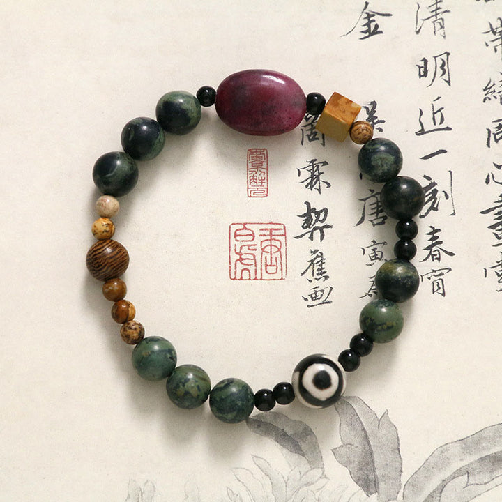 Buddha Stones Armband mit dreiäugigen Dzi-Perlen aus grünem Achat und Krafterfolg