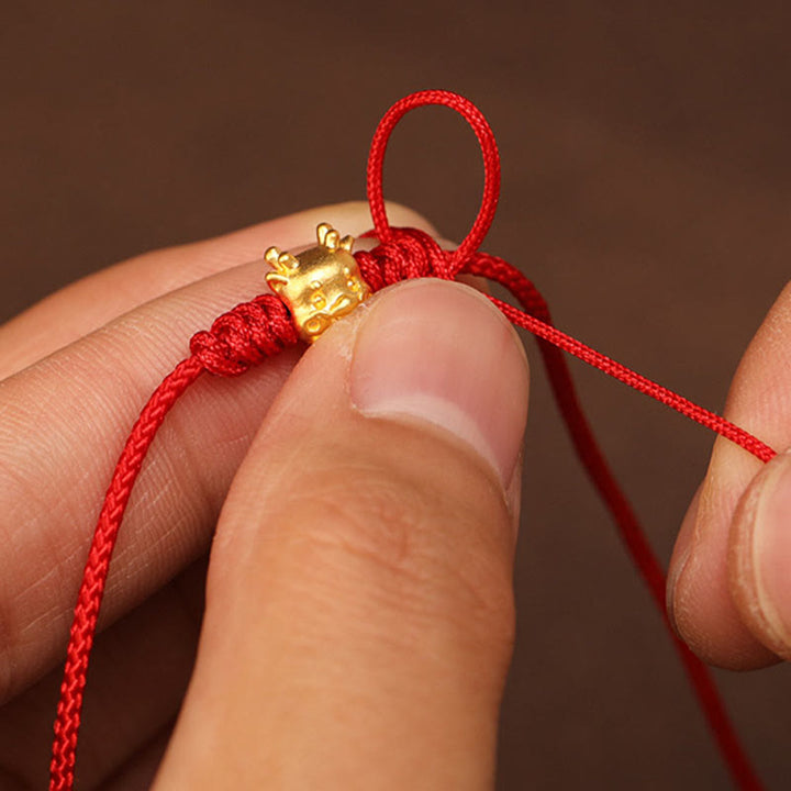 Bauchkette mit Buddha-Stein, 999er-Gold, rote Schnur