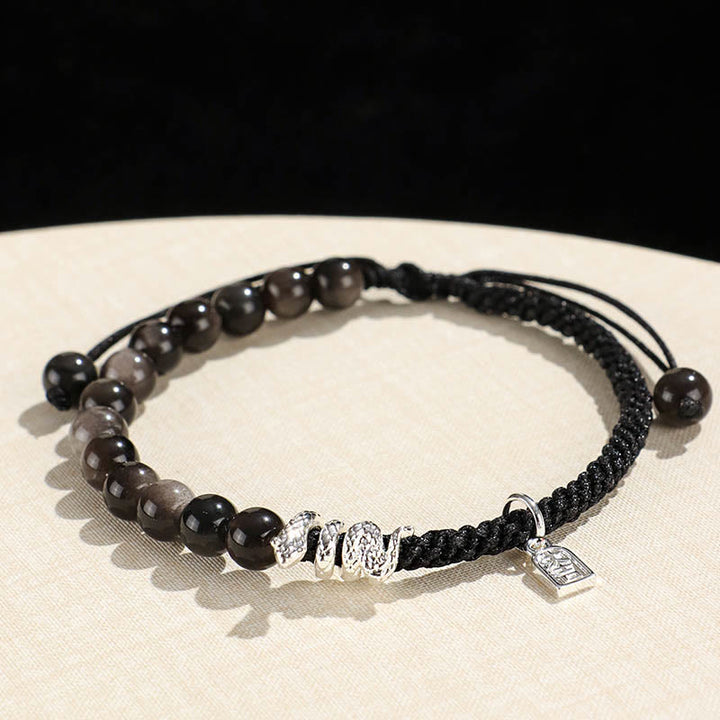 Buddha Stones Natürlicher Erdbeerquarz Silberglanz Obsidian Jahr der Schlange Schnur Schutz Geflochtenes Armband