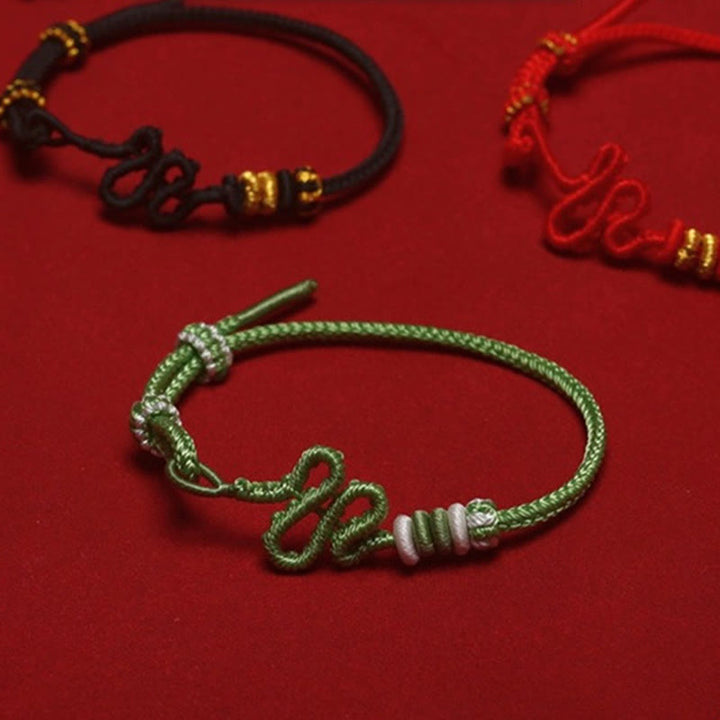 Buddha Stones Rote Schnur Schlangenknoten Jahr der Schlange Schutz Geflochtenes Armband