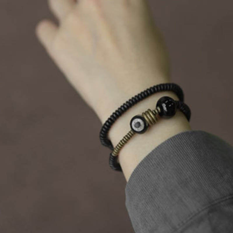 Buddha Stones , Ebenholz, grünes Sandelholz, Kupfer, Messing, Dzi-Perle, schwarzer Onyx, ruhiges Doppel-Wickelarmband