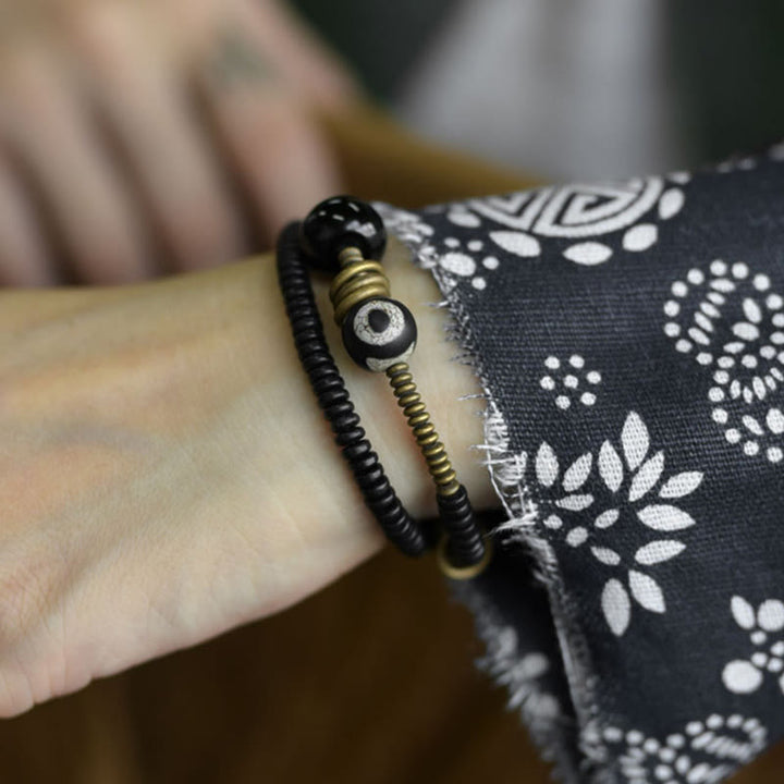 Buddha Stones , Ebenholz, grünes Sandelholz, Kupfer, Messing, Dzi-Perle, schwarzer Onyx, ruhiges Doppel-Wickelarmband