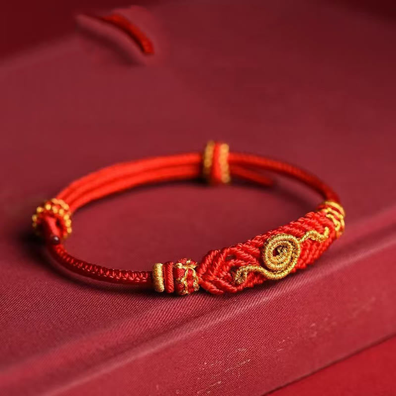 Handgemachtes rotes Armband mit acht Fäden des Friedensknotens aus Buddha Stones, Jahr der Schlange, Schutz, Glück, geflochten