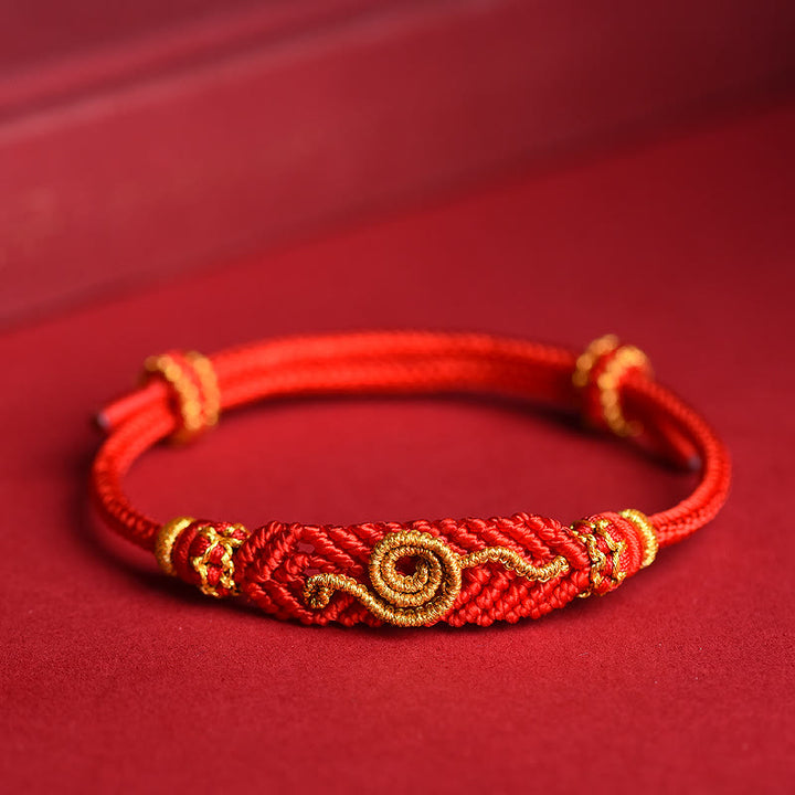 Handgemachtes rotes Armband mit acht Fäden des Friedensknotens aus Buddha Stones, Jahr der Schlange, Schutz, Glück, geflochten