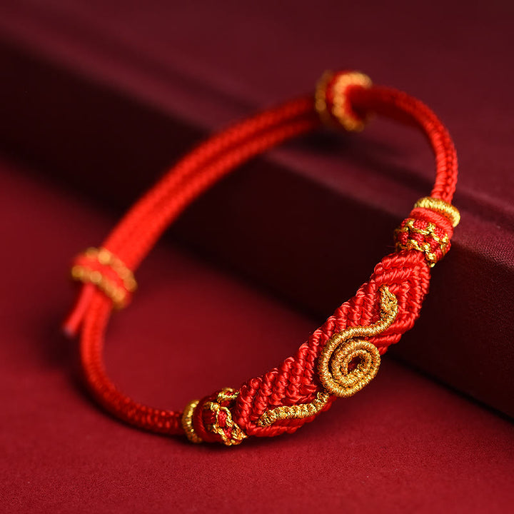 Handgemachtes rotes Armband mit acht Fäden des Friedensknotens aus Buddha Stones, Jahr der Schlange, Schutz, Glück, geflochten