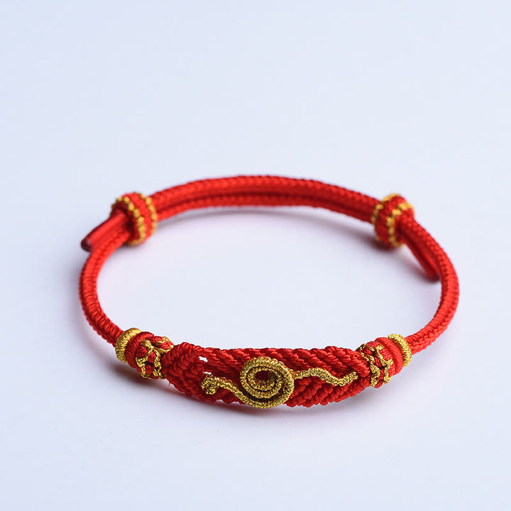 Handgemachtes rotes Armband mit acht Fäden des Friedensknotens aus Buddha Stones, Jahr der Schlange, Schutz, Glück, geflochten