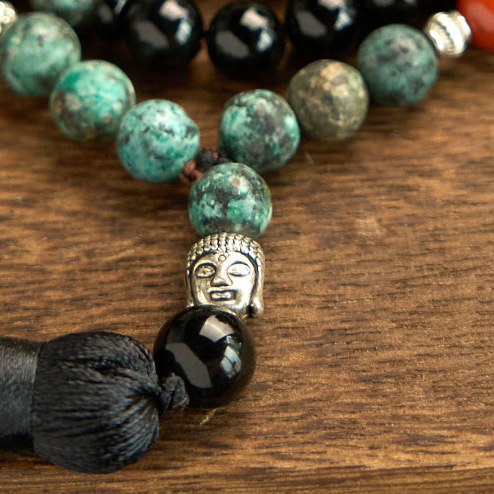 Buddha Stones 108 Mala, natürlicher schwarzer Onyx, roter Jaspis, Türkisperlen, Buddhakopf, Quaste, Schutzarmband