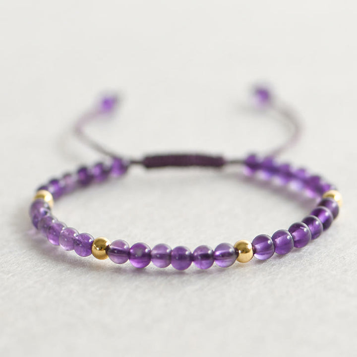 Armband mit Buddha Stones, 4 mm, handgefertigt, natürlicher Amethyst, 14 Karat vergoldete Kupferperlen, geflochtene Schnur, lindert Stress