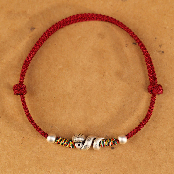 Fußkettchen „Jahr der Schlange“ von Buddha Stones aus 999er Sterlingsilber mit roter Schnur