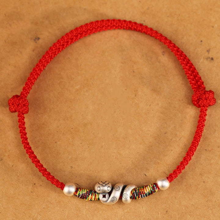 Fußkettchen „Jahr der Schlange“ von Buddha Stones aus 999er Sterlingsilber mit roter Schnur