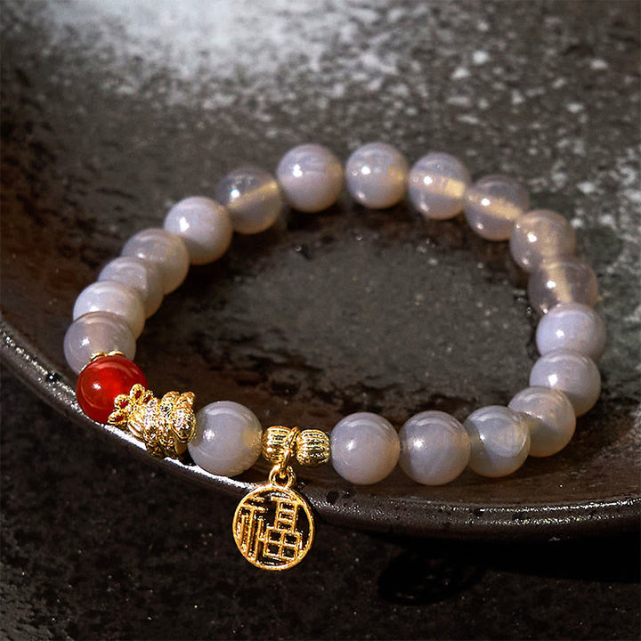 Buddha Stones Jahr der Schlange Grauer Achat Roter Achat Fu Charakter Positivität Armband