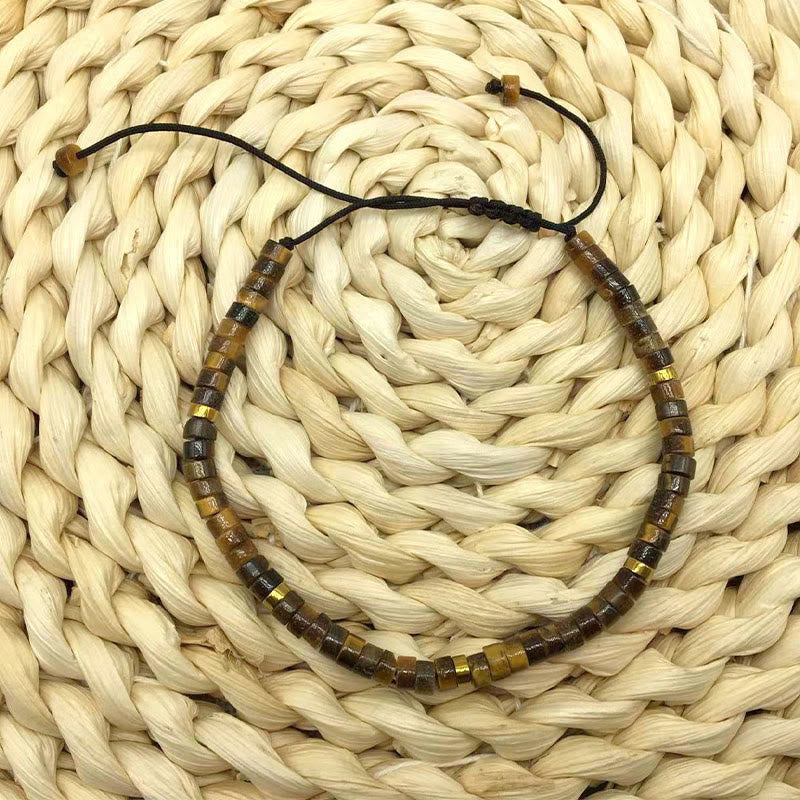 Buddha Stones Armband mit natürlichen Tigeraugen-Abstandsperlen und Mut