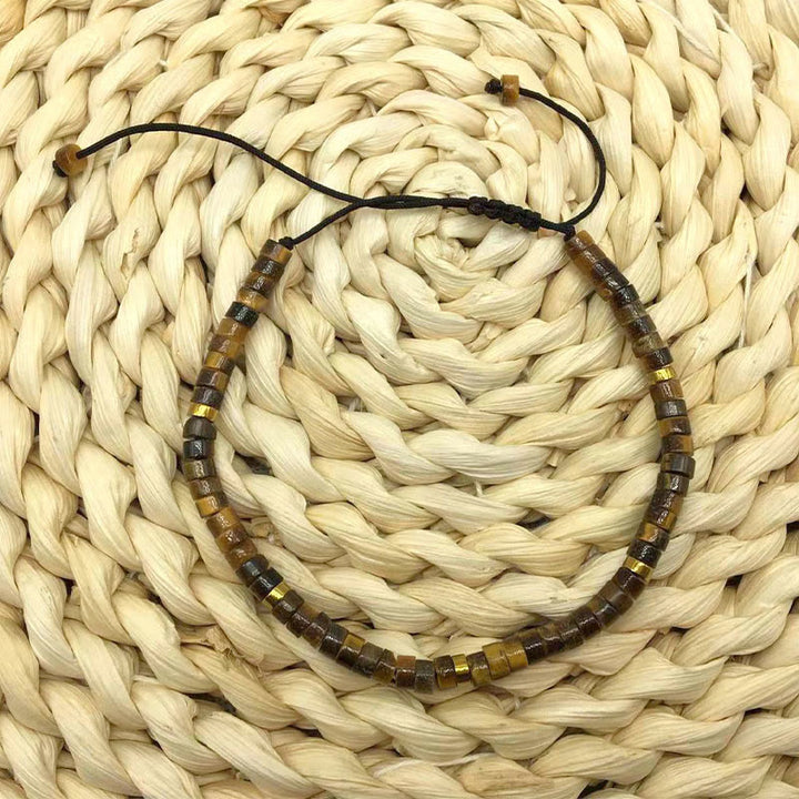 Buddha Stones Armband mit natürlichen Tigeraugen-Abstandsperlen und Mut