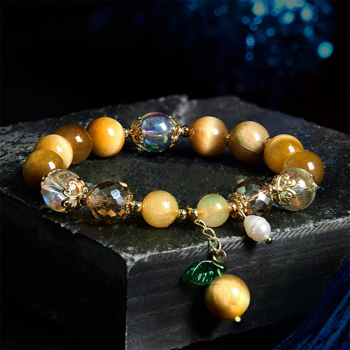 Buddha Stones Armband mit natürlichen Tigeraugen-Perlen und grünem Blattmotiv